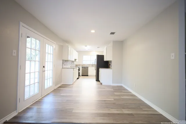 a view of kitchen with wooden floor