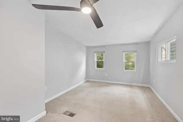 an empty room with windows