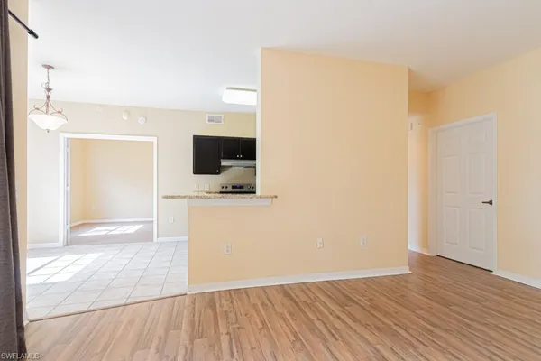 a kitchen with a stove and a refrigerator