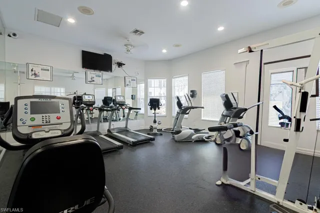 a view of a patio with dining table and chairs with plants