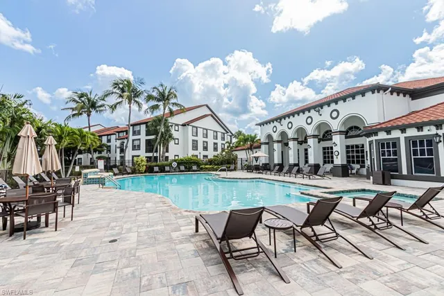 a front view of multiple houses with yard