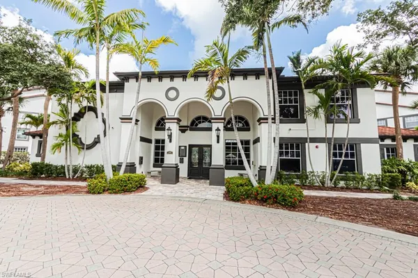 a view of a lake with a house in the background
