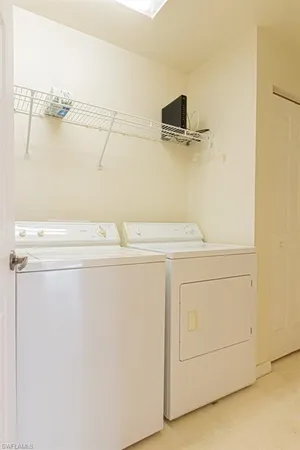 an empty room with wooden floor and a window