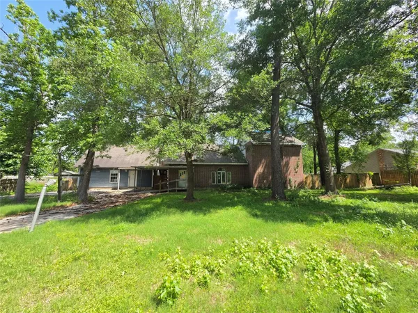 a view of a house with a yard porch and sitting area