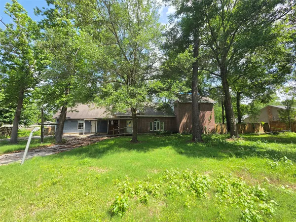 a view of a house with a yard porch and sitting area