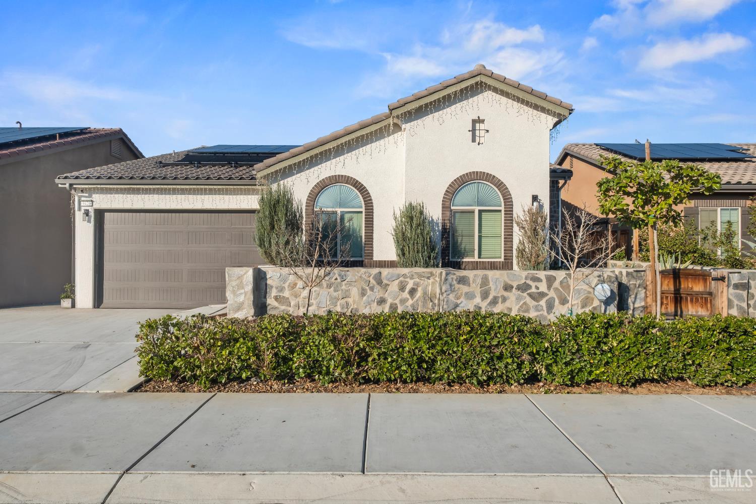 Undisclosed Address Shafter, CA 93263 - Photo 1 of 38 a front view of a house with a garden