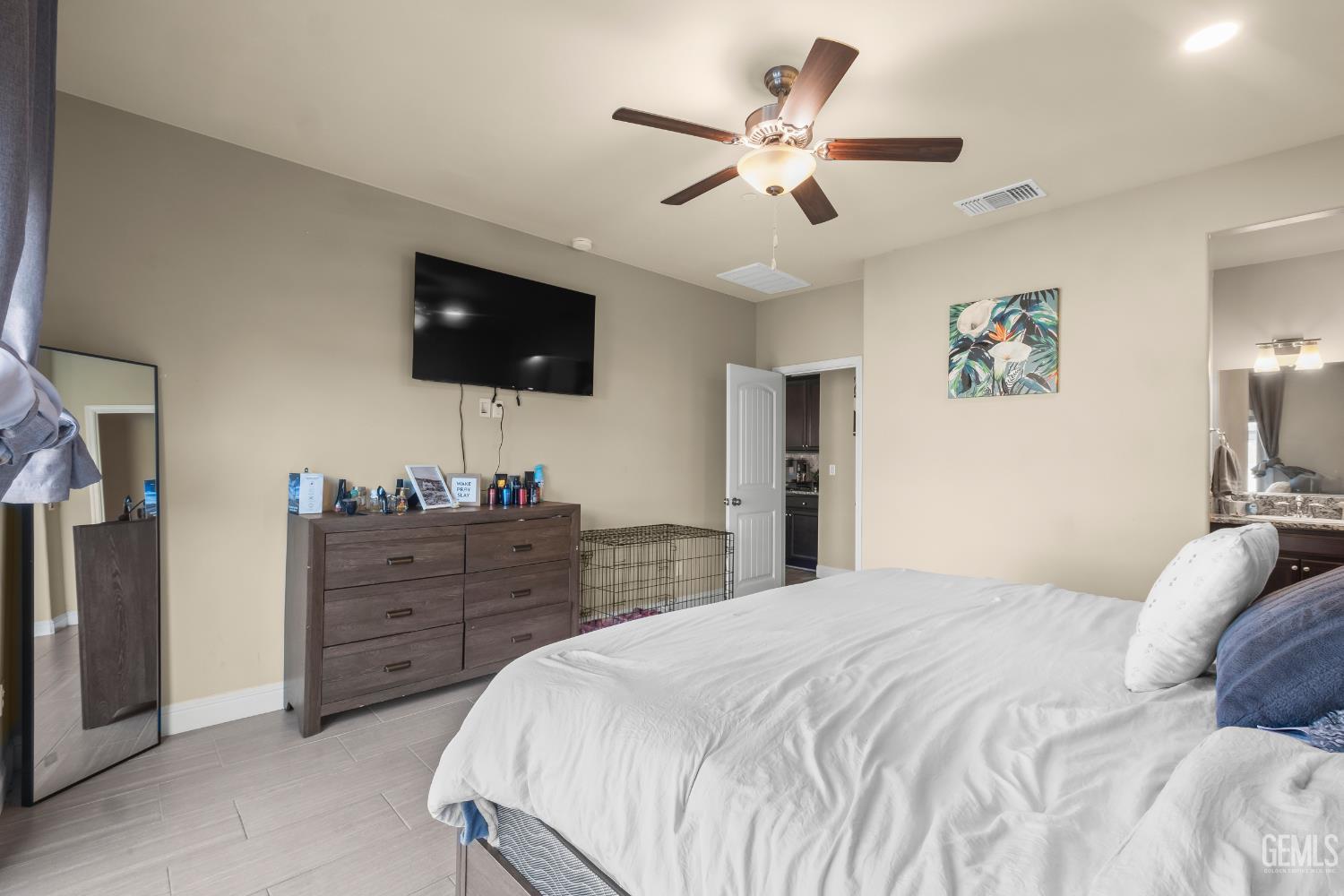 Undisclosed Address Shafter, CA 93263 - Photo 16 of 38 a bedroom with a large bed and a flat screen tv