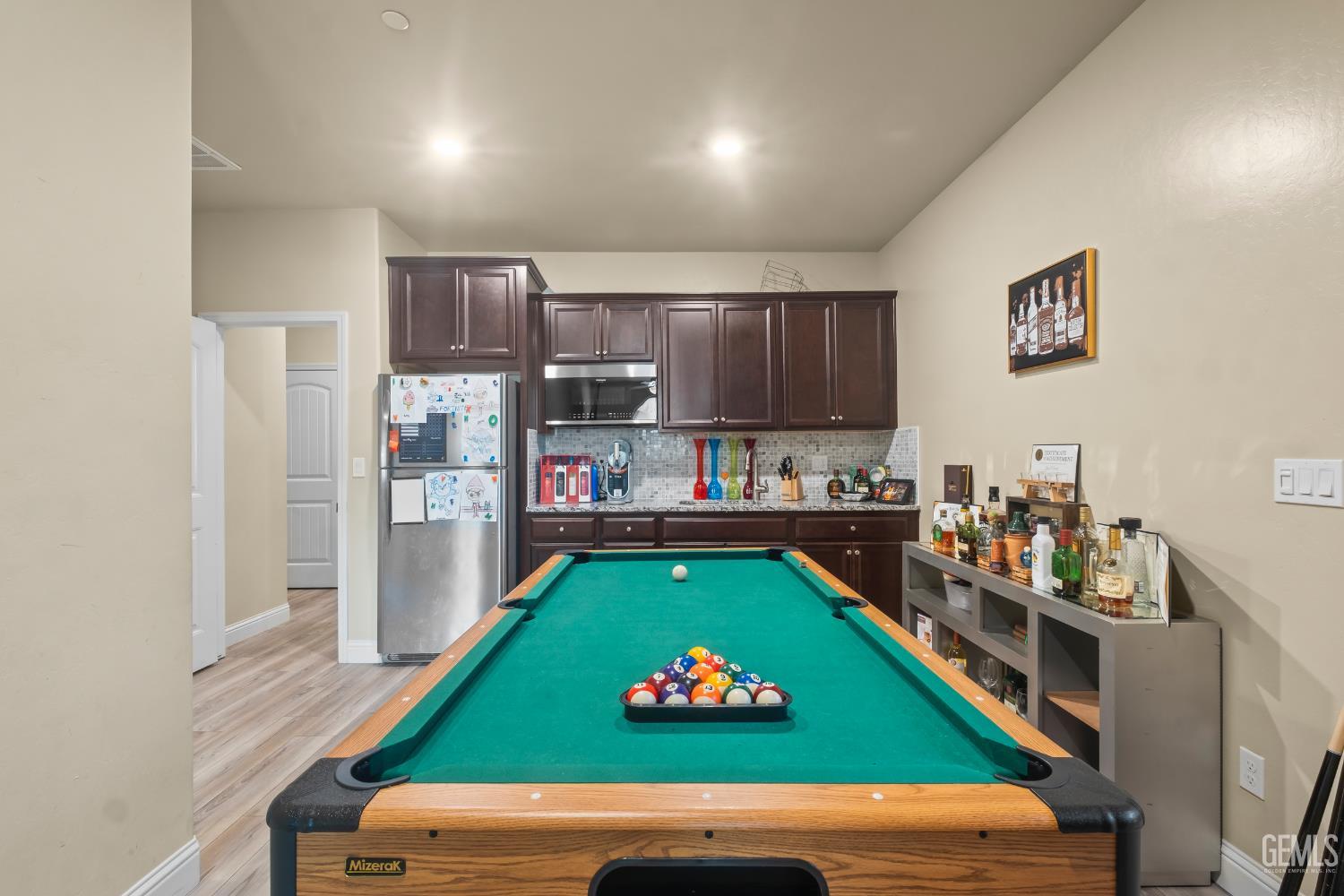 Undisclosed Address Shafter, CA 93263 - Photo 22 of 38 a room with microwave oven table and chairs