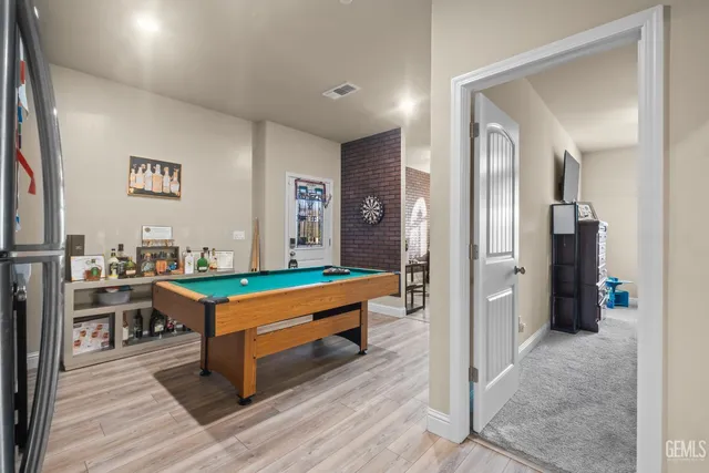 a room with wooden floor and furniture