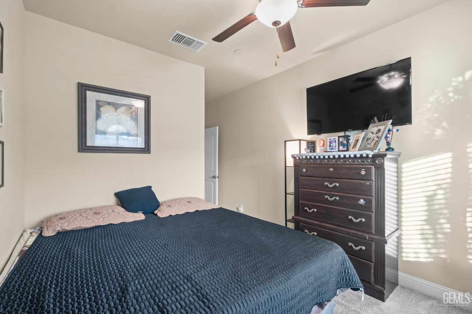 Undisclosed Address Shafter, CA 93263 - Photo 26 of 38 a bedroom with a bed and a flat screen tv