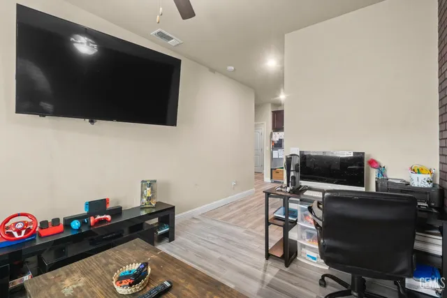 a room with furniture and flat screen tv