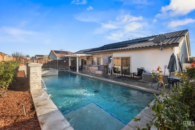 a view of a house with tub and view of a lake