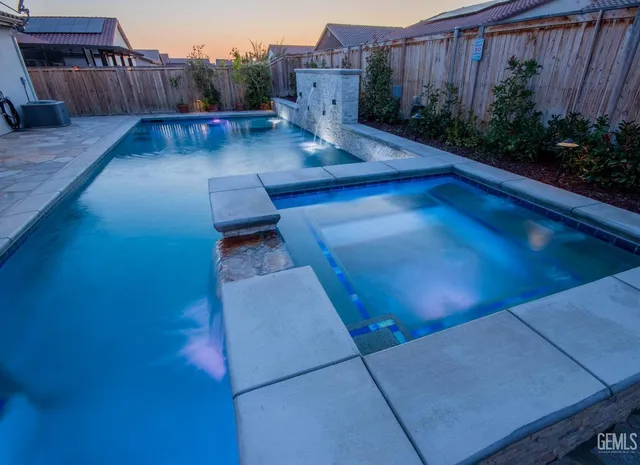 a view of a backyard with sitting area