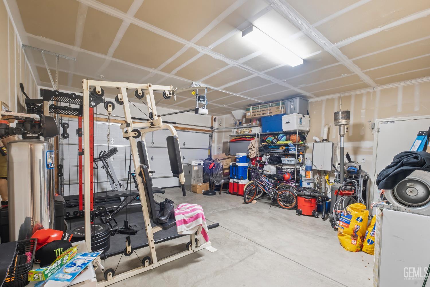 Undisclosed Address Shafter, CA 93263 - Photo 38 of 38 a view of a garage with a bike and storage