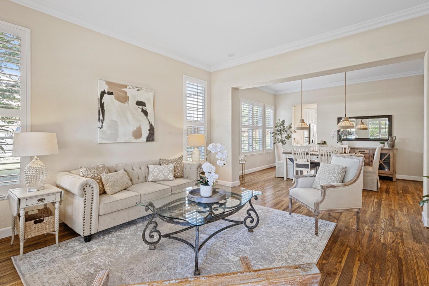 1937 St Andrews Circle Gilroy, CA 95020 - Photo 14 of 64 a living room with furniture dining table and a wooden floor