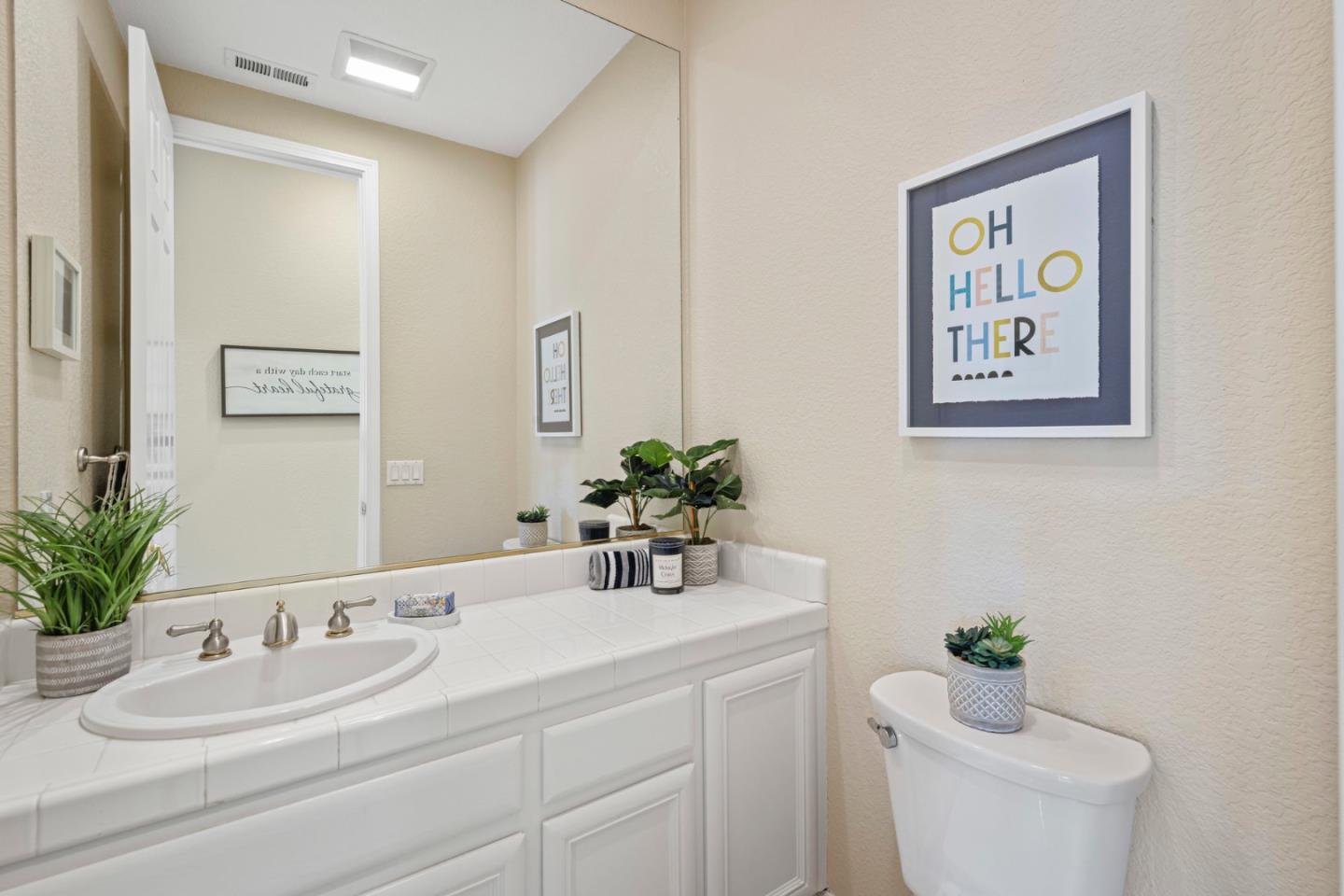 1937 St Andrews Circle Gilroy, CA 95020 - Photo 22 of 64 a bathroom with a sink a toilet and a mirror