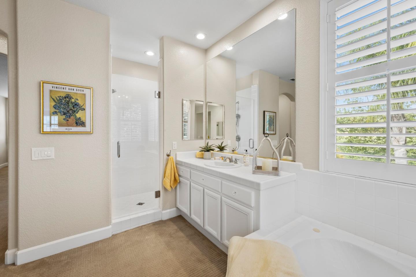 1937 St Andrews Circle Gilroy, CA 95020 - Photo 37 of 64 a bathroom with a double vanity sink mirror and a bathtub