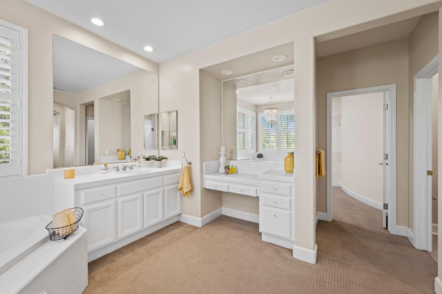 1937 St Andrews Circle Gilroy, CA 95020 - Photo 38 of 64 a large bathroom with a double vanity sink a mirror and a bathtub