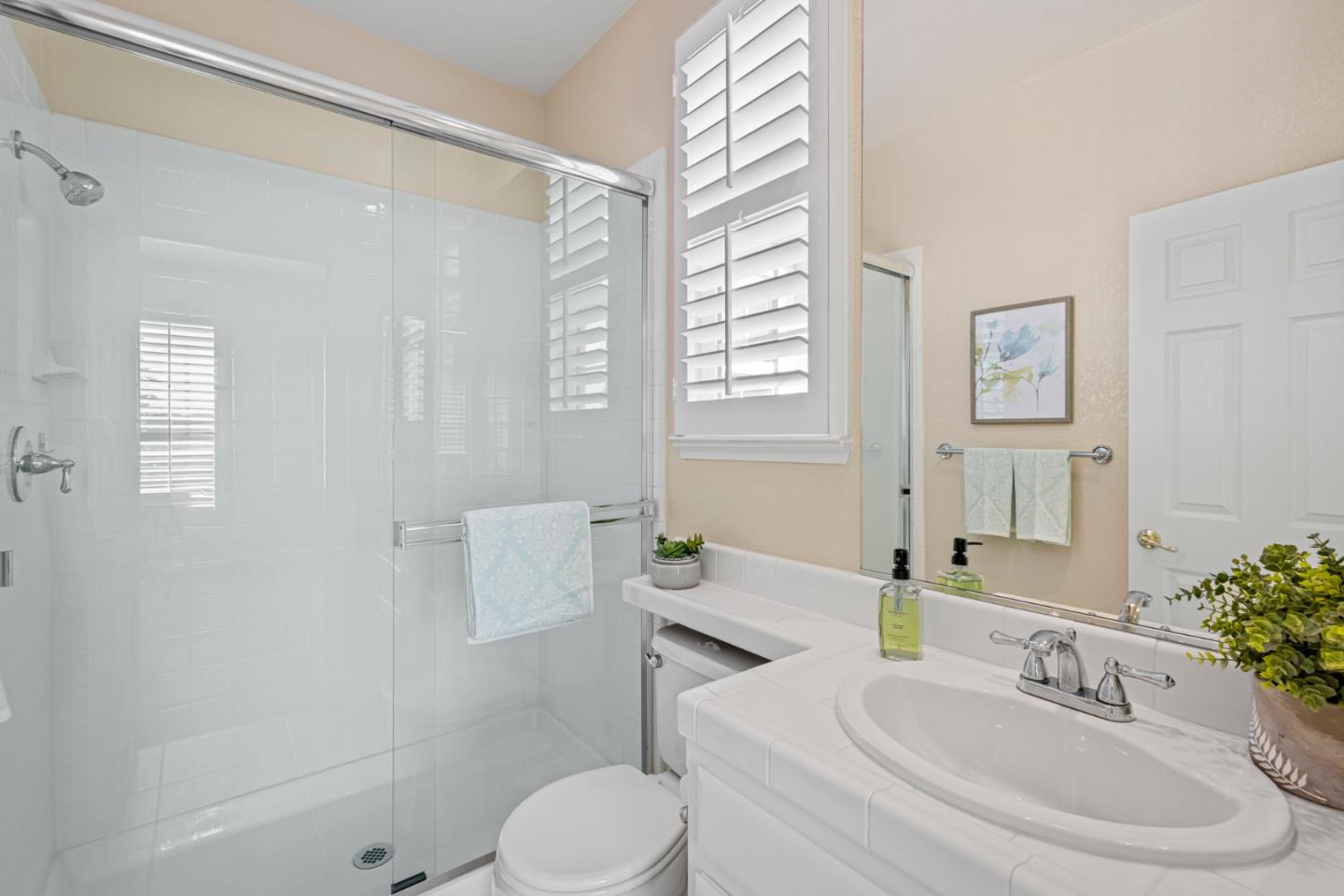 1937 St Andrews Circle Gilroy, CA 95020 - Photo 48 of 64 a bathroom with a sink a toilet and shower