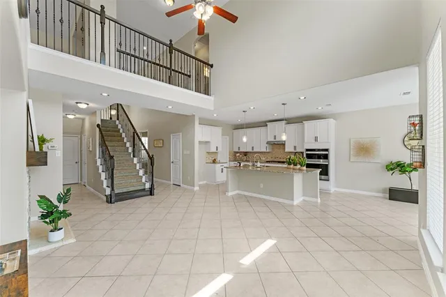 a view of kitchen with furniture and refrigerator
