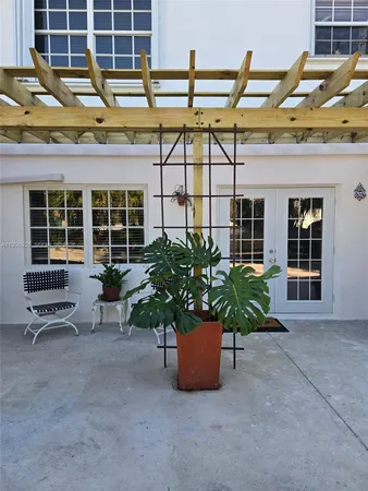 a view of a chairs and table in a patio