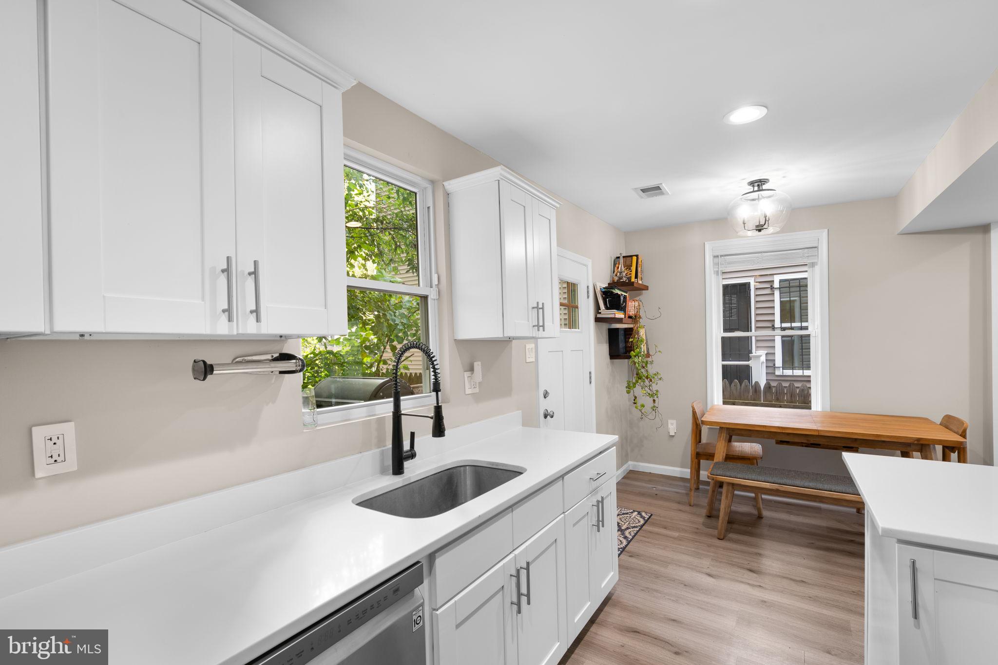 1015 48th Street Northeast Washington, DC 20019 - Photo 11 of 28 a kitchen with a sink and a window