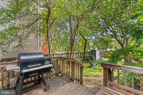 a view of a balcony with furniture