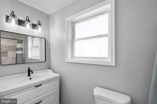 a bathroom with a sink and a toilet