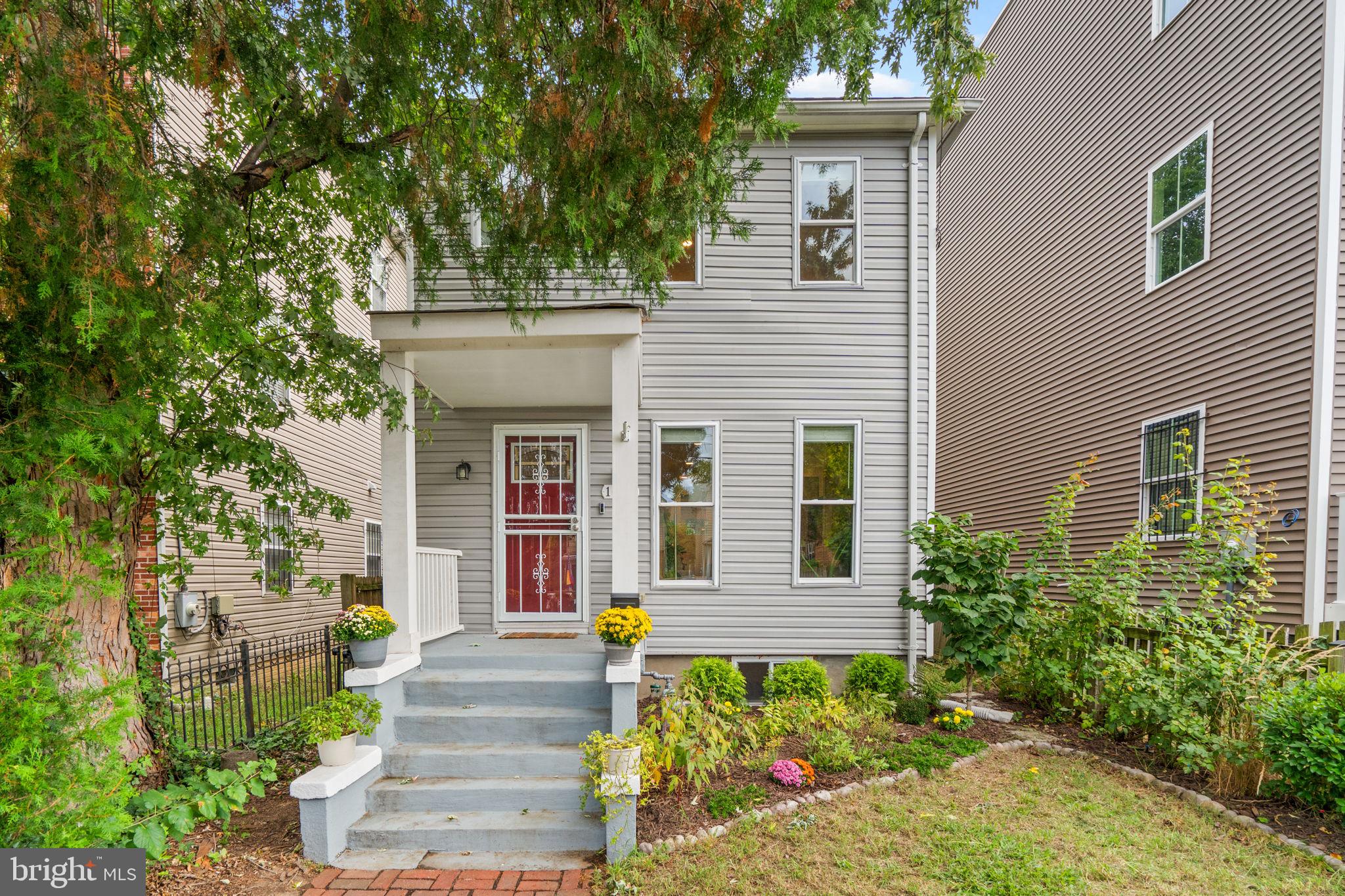 1015 48th Street Northeast Washington, DC 20019 - Photo 2 of 28 a front view of a house with plants