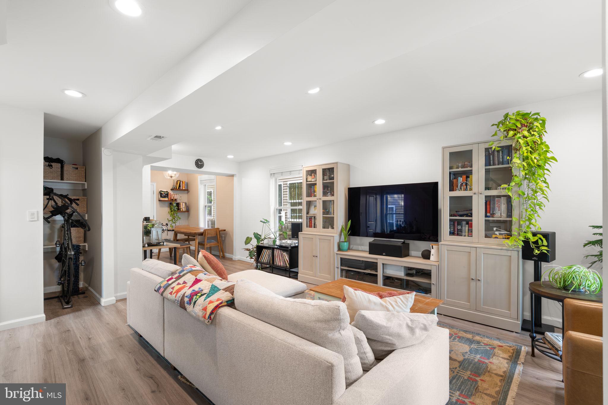 1015 48th Street Northeast Washington, DC 20019 - Photo 6 of 28 a living room with furniture and a flat screen tv