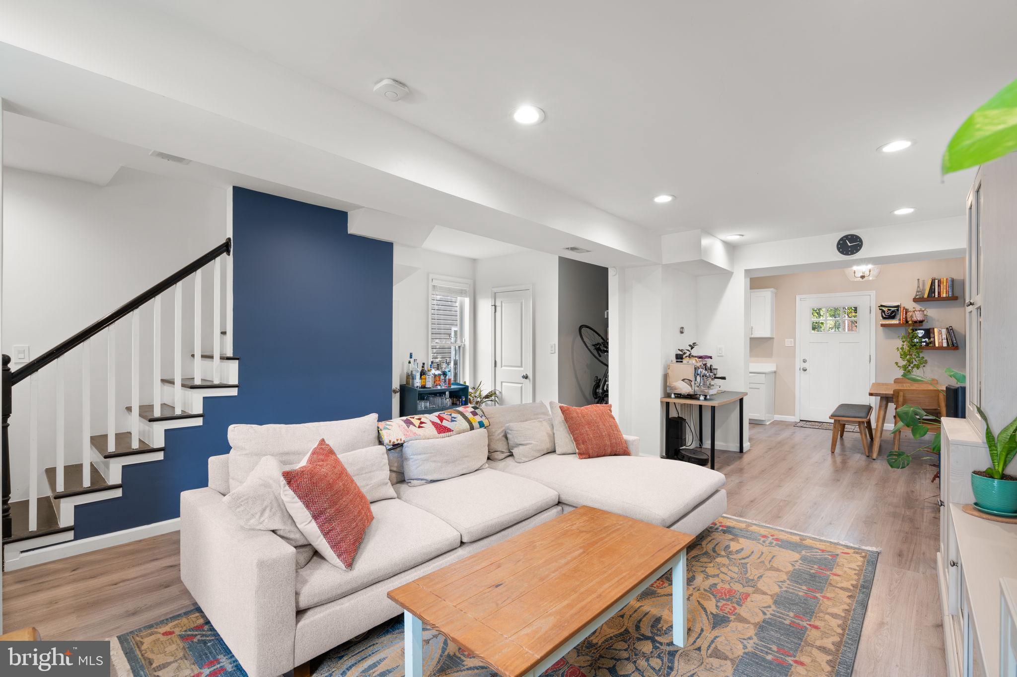 1015 48th Street Northeast Washington, DC 20019 - Photo 7 of 28 a living room with furniture and wooden floor