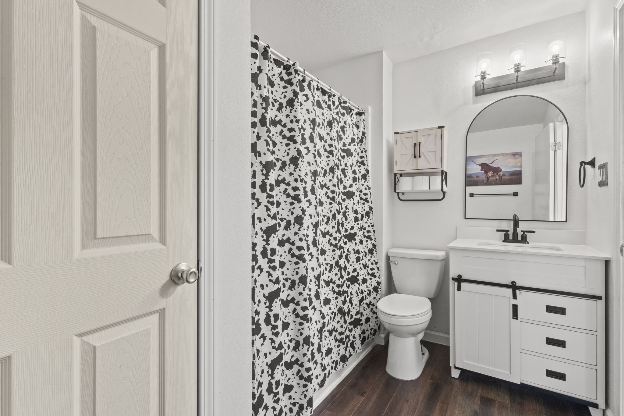19961 Englin Road Winnie, TX 77665 - Photo 24 of 26 a bathroom with a toilet a sink and a mirror