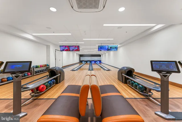 a living room with furniture gym equipment and a flat screen tv