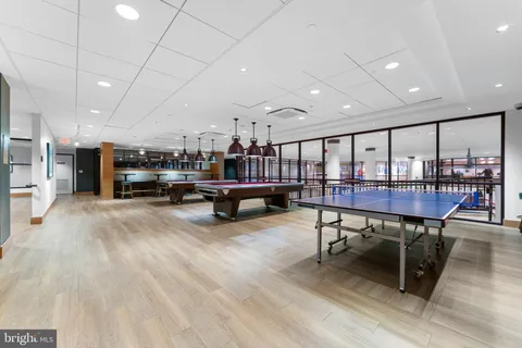 a view of a room with furniture and a rug