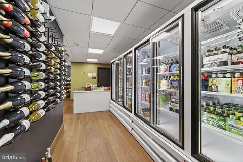 a view of a livingroom with furniture and a ceiling fan