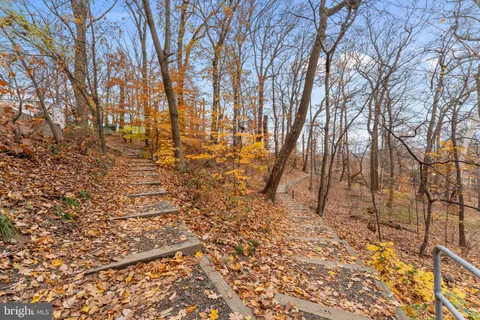 a hallway with painting on the wall and a wall painting