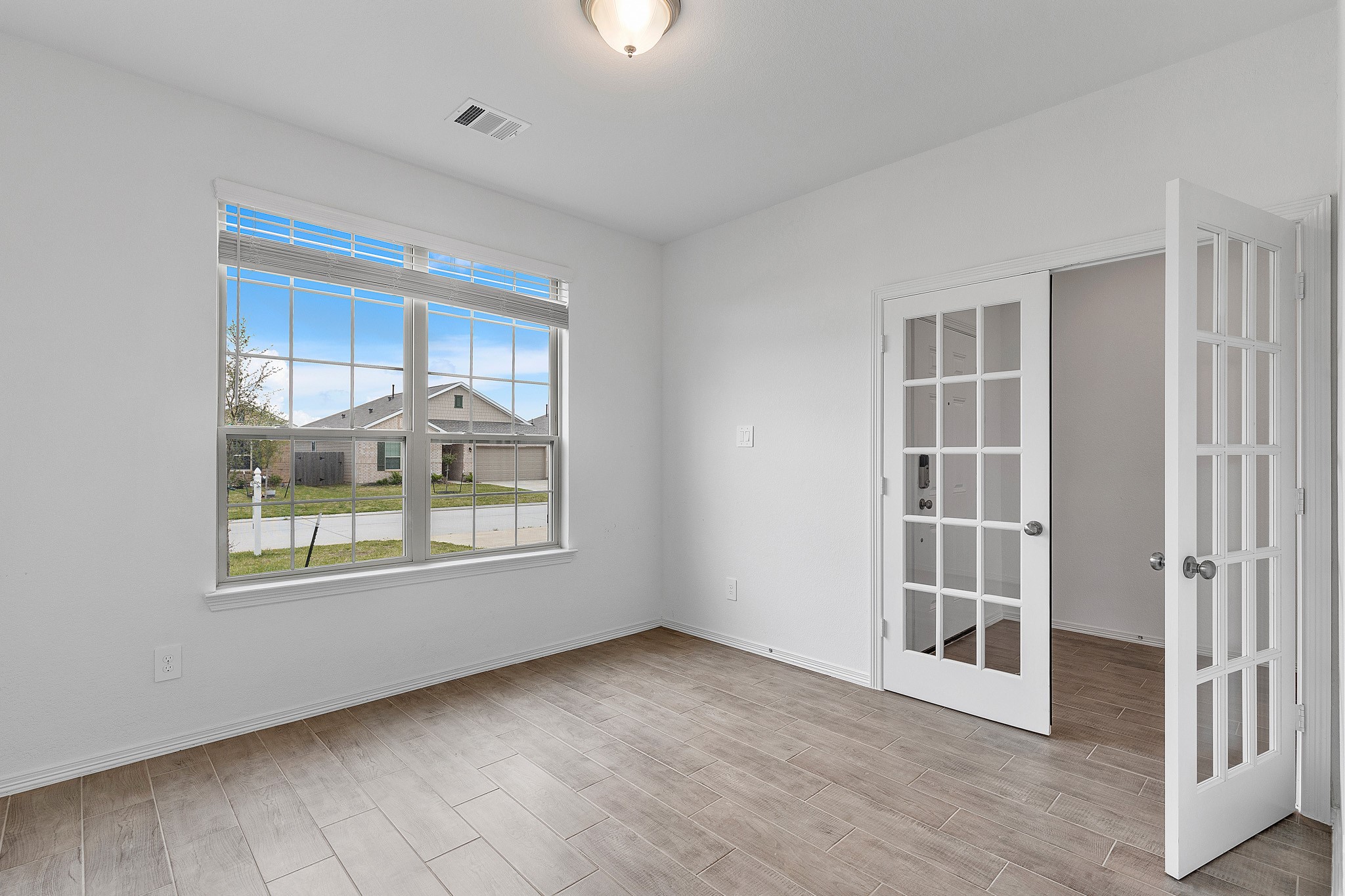 9658 Caney Trails Road Conroe, TX 77303 - Photo 11 of 50 an empty room with windows