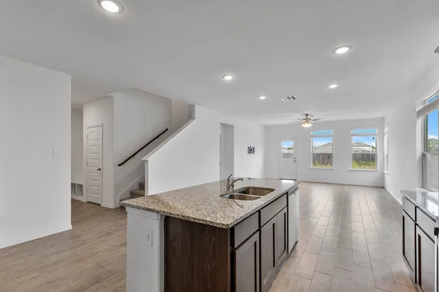 a kitchen that has a lot of cabinets