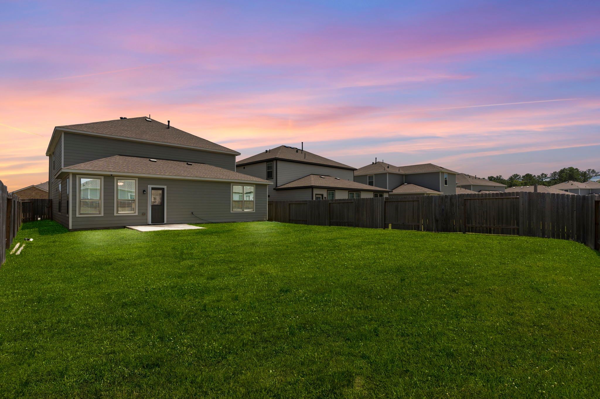 9658 Caney Trails Road Conroe, TX 77303 - Photo 4 of 50 a view of a yard with a house in the background