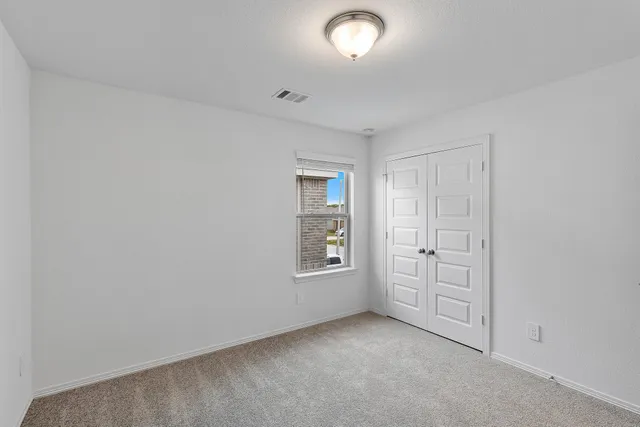 a view of an empty room with stairs