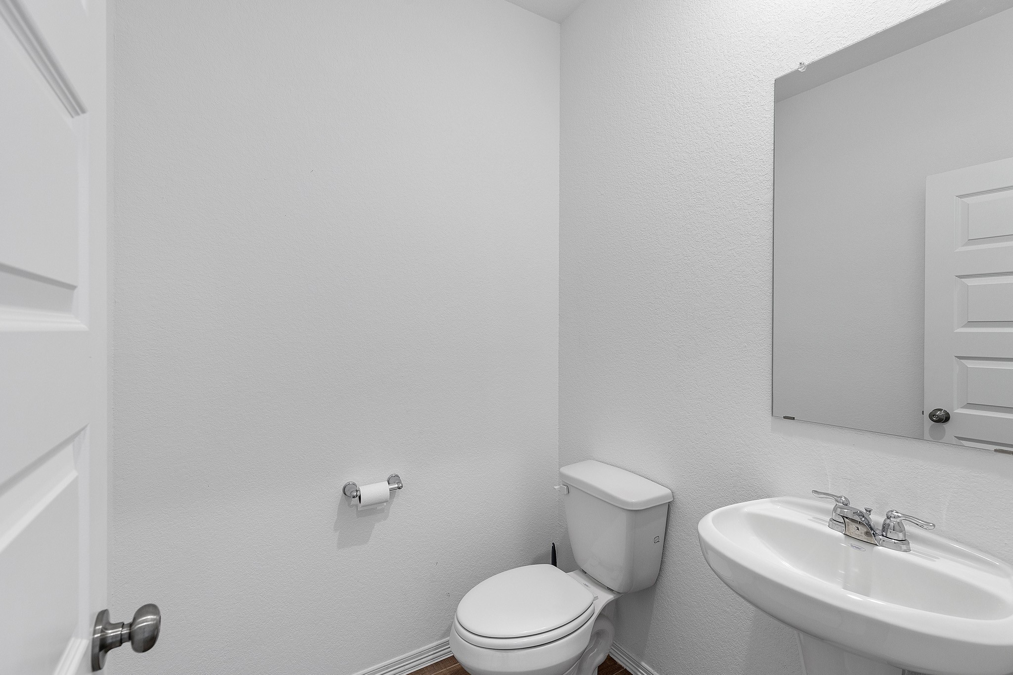 9658 Caney Trails Road Conroe, TX 77303 - Photo 47 of 50 a bathroom with a sink a toilet and a mirror