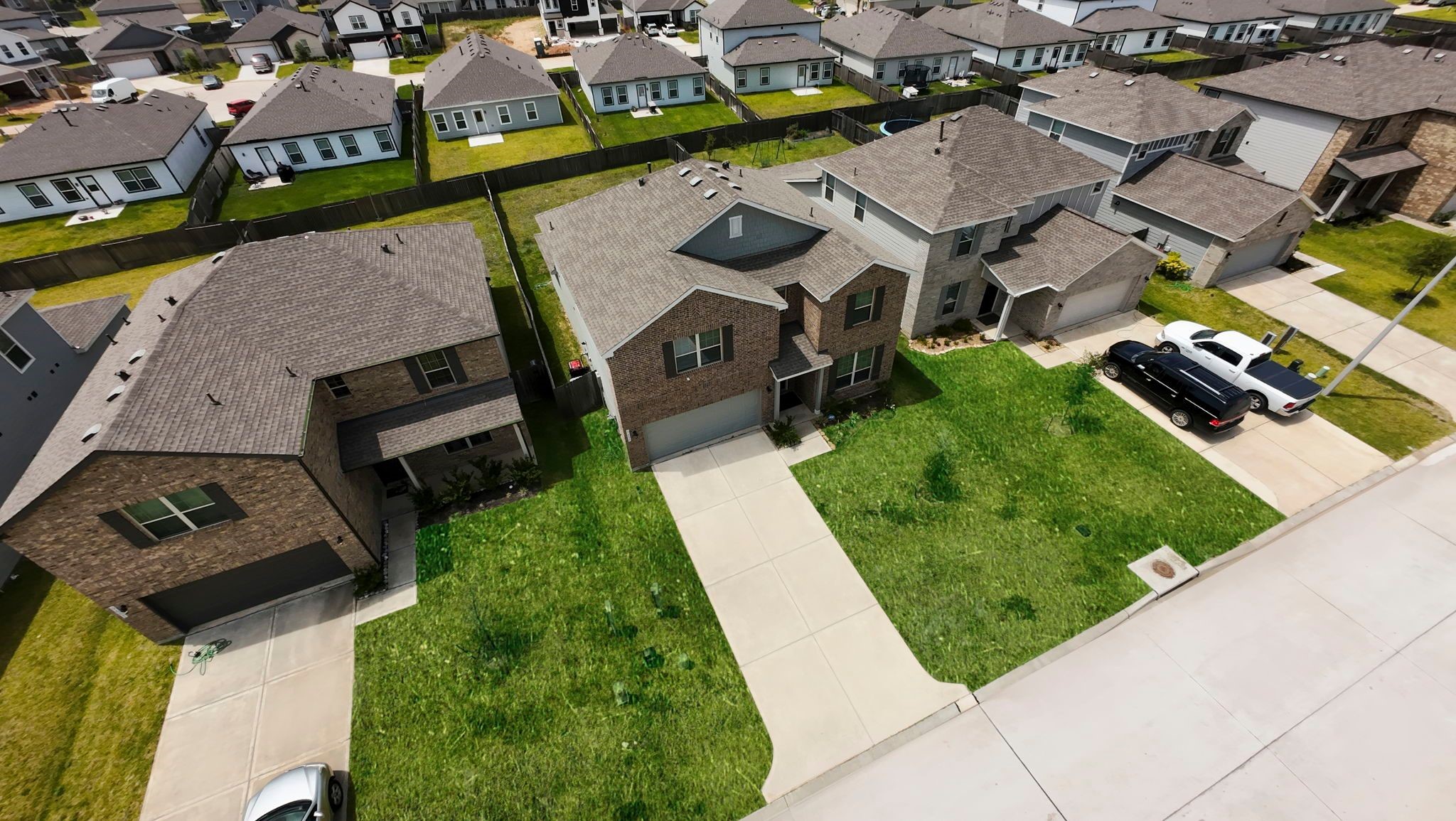 9658 Caney Trails Road Conroe, TX 77303 - Photo 49 of 50 an aerial view of a house with garden space and street view