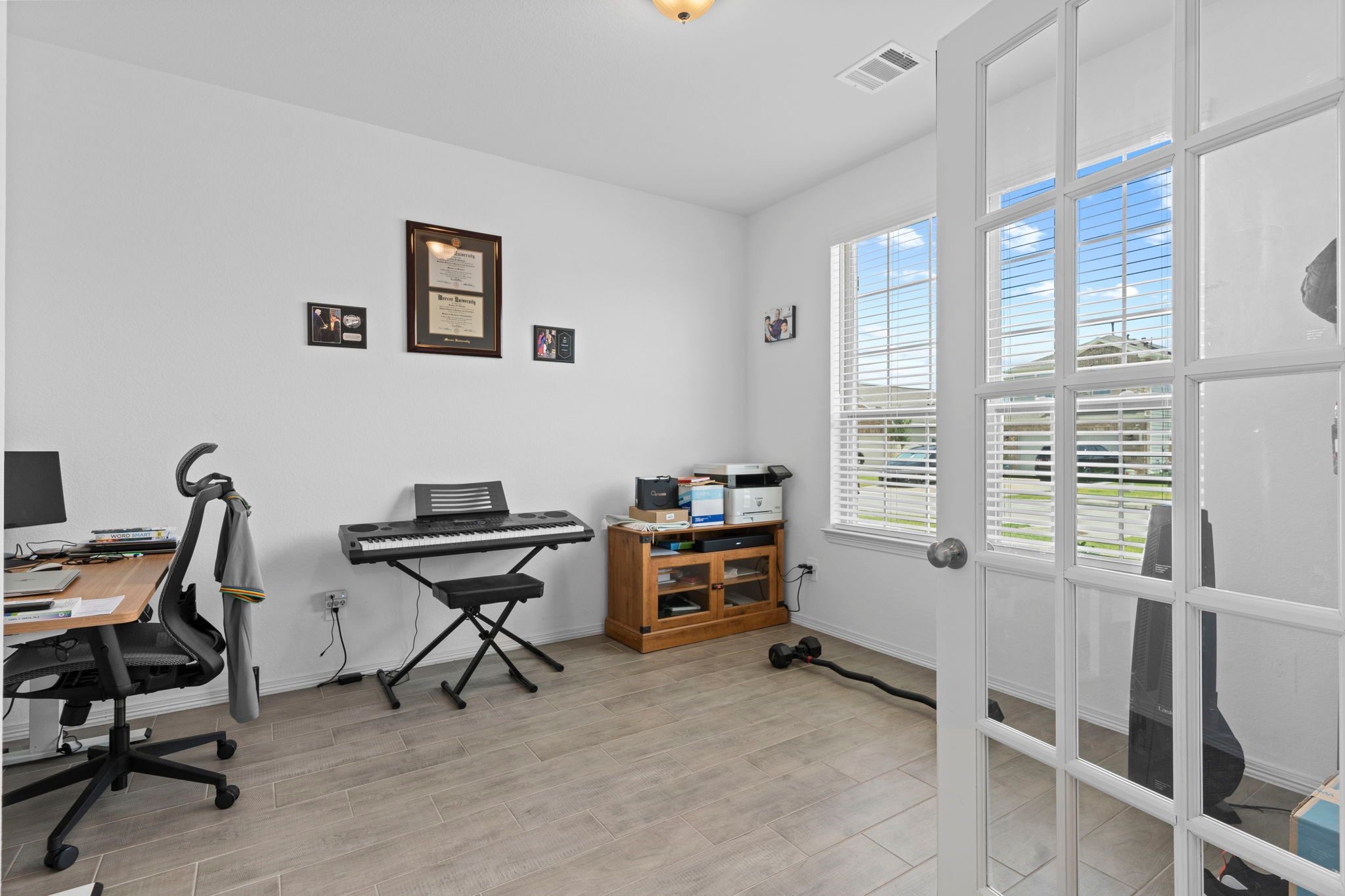9658 Caney Trails Road Conroe, TX 77303 - Photo 9 of 50 a view of a workspace with furniture and a window