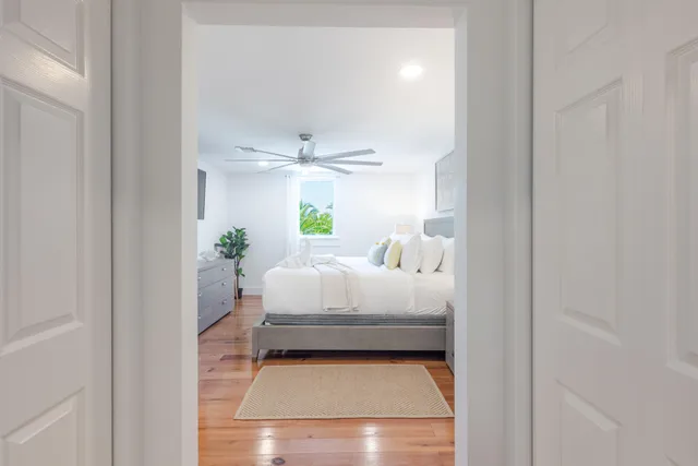a bathroom with a white tub and shower