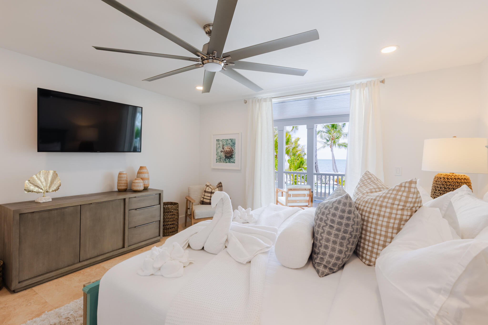 65760 Overseas Highway Long Key, FL 33001 - Photo 13 of 19 a bedroom with a large bed and a flat screen tv