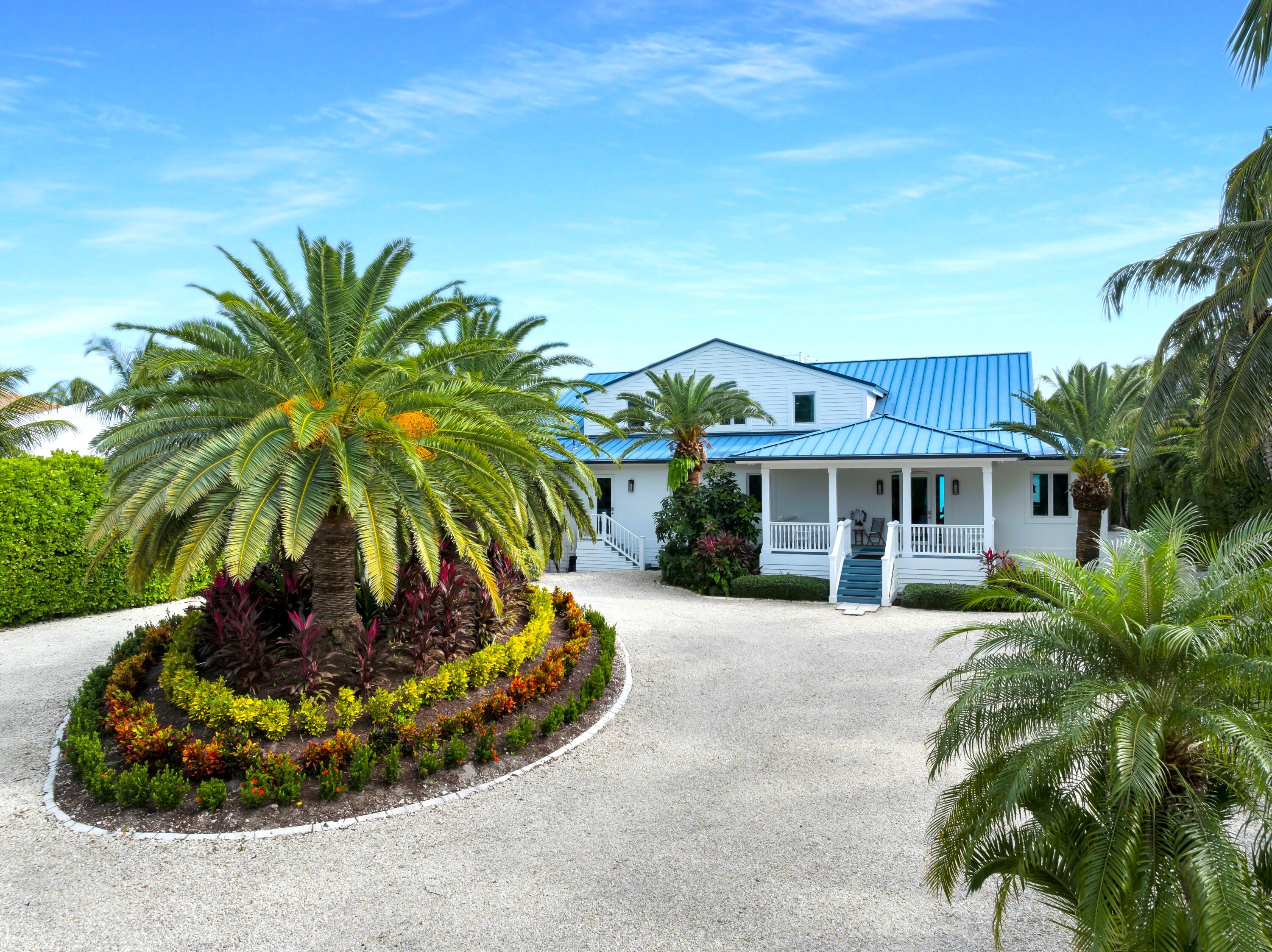 65760 Overseas Highway Long Key, FL 33001 - Photo 16 of 19 a front view of a house with a yard