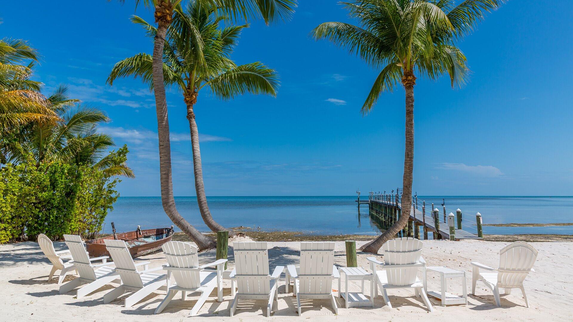 65760 Overseas Highway Long Key, FL 33001 - Photo 2 of 19 a view of swimming pool with a table and chairs