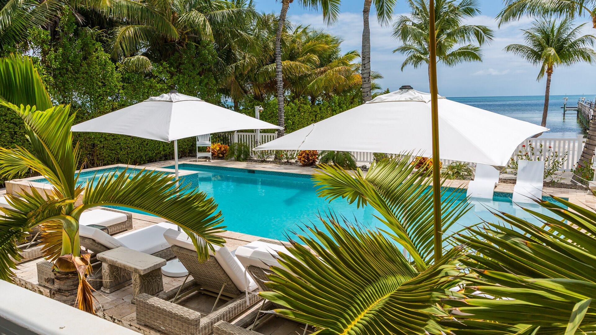 65760 Overseas Highway Long Key, FL 33001 - Photo 3 of 19 a view of a swimming pool with chairs