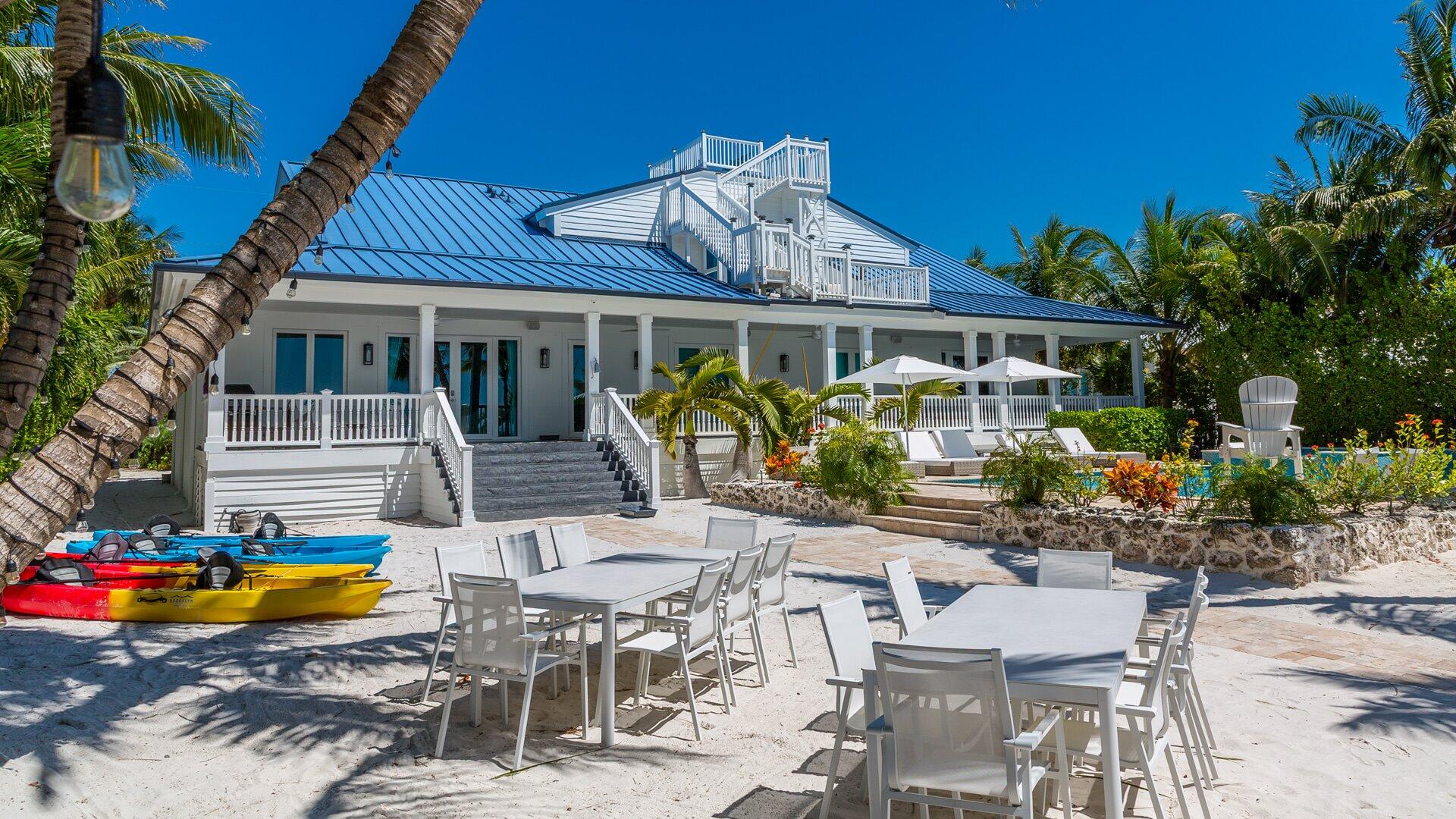 65760 Overseas Highway Long Key, FL 33001 - Photo 7 of 19 a view of a patio with table and chairs and potted plants