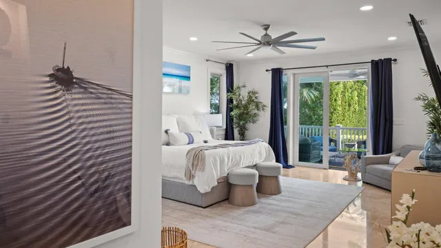 a bed room with a bed and a large window